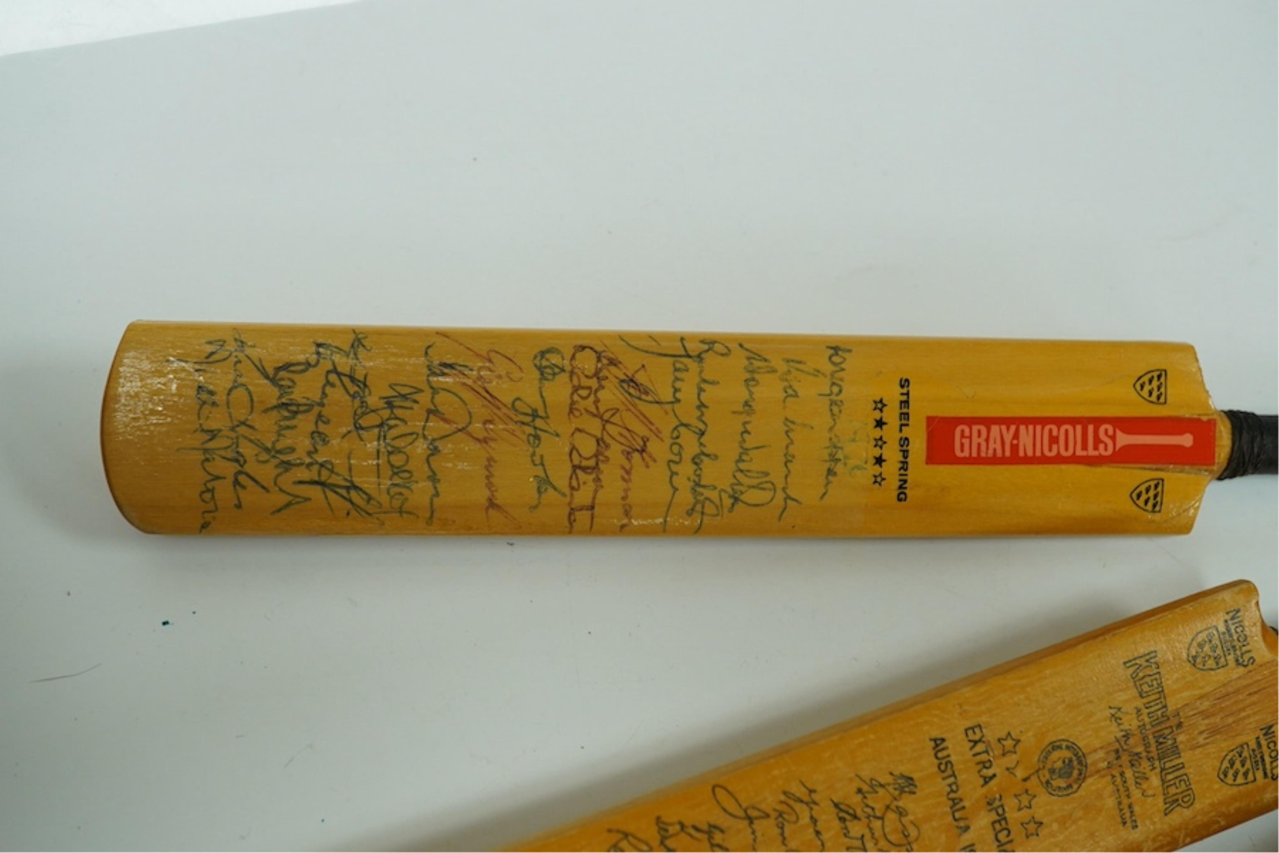 Four miniature model cricket bats, one signed, others printed. Condition - fair to good